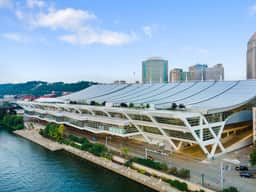 Iconic waterfront city views beside a stunning modern convention center