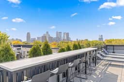 Modern Apt with Rooftop & City Views - Image 4
