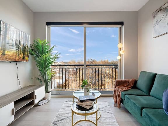 Modern oasis with stunning views, cozy velvet sofa, and chic decor. Relax & unwind!